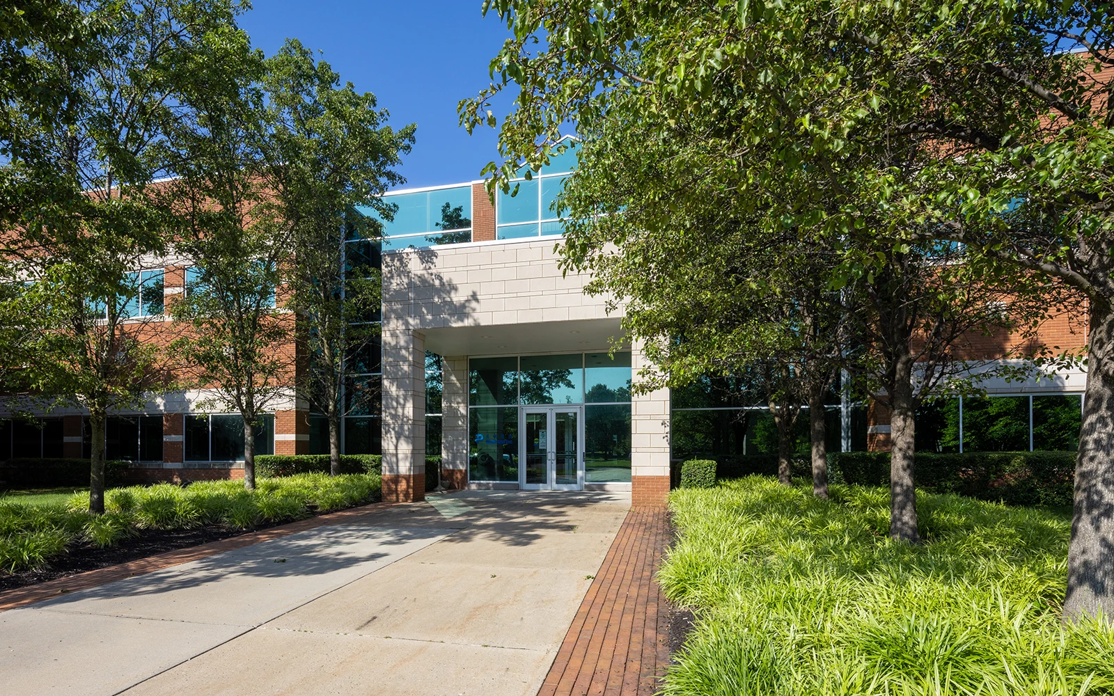 Corporate campus entrance with lush green front lawn
