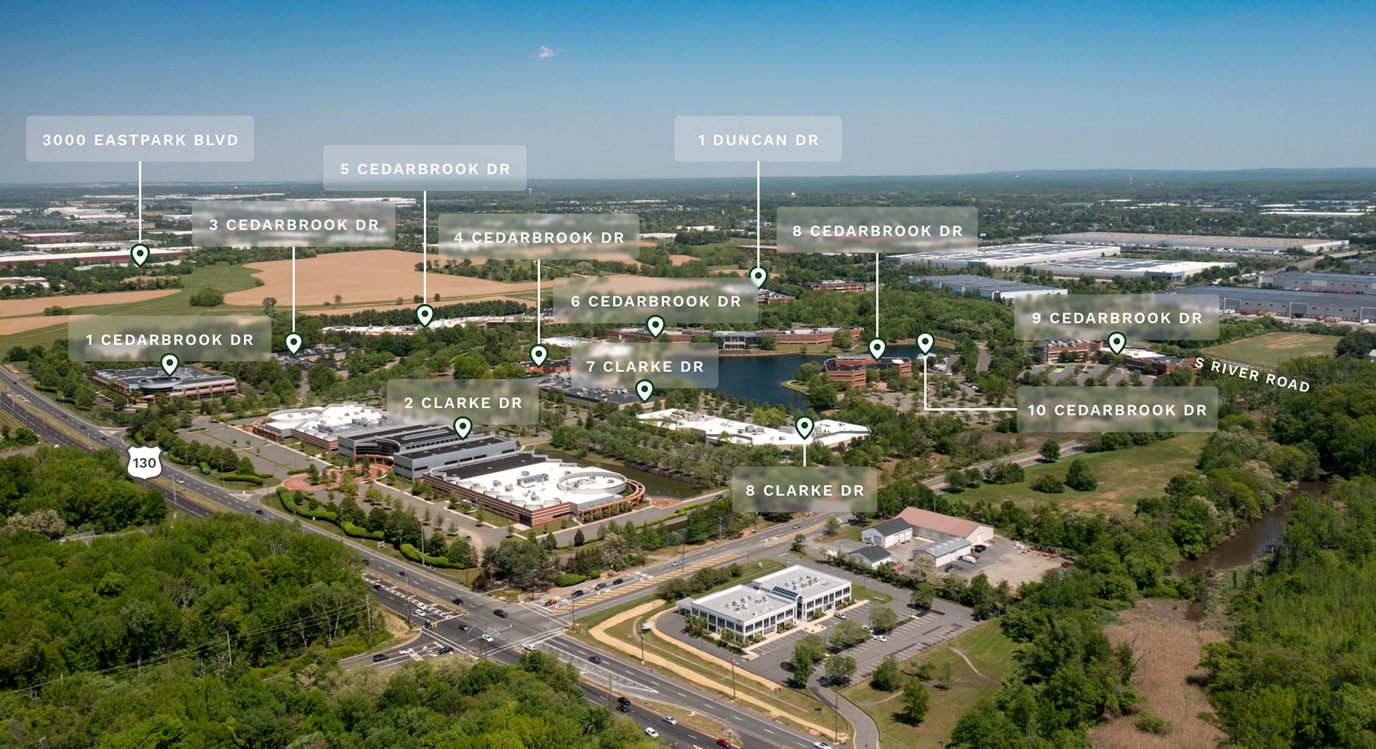 Aerial view of Cedar Brook corporate center campus with labeled buildings and surrounding roadways